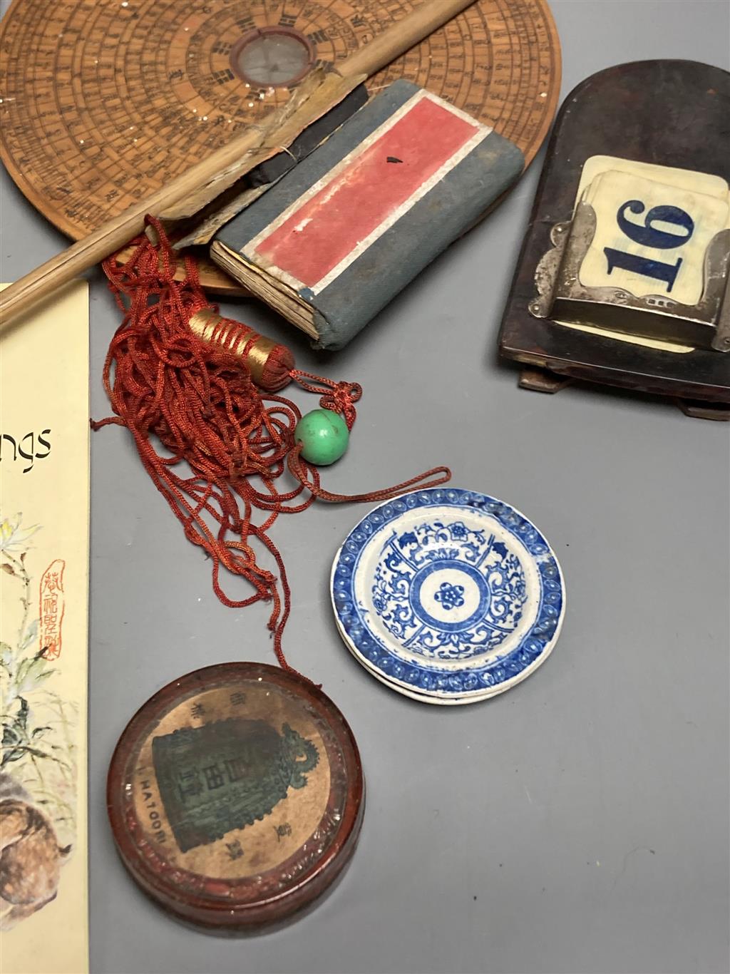 A group of Chinese and Japanese objects, 19th/20th century, including an inscribed ink box an inkstone, a lacquer bookslide, two Tibeta